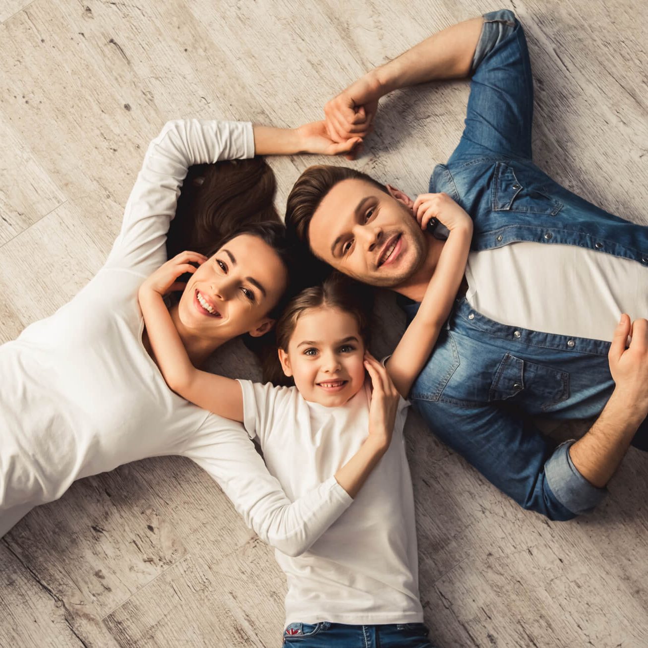 Family on laminate | Flooring by Wilson's Carpet Plus