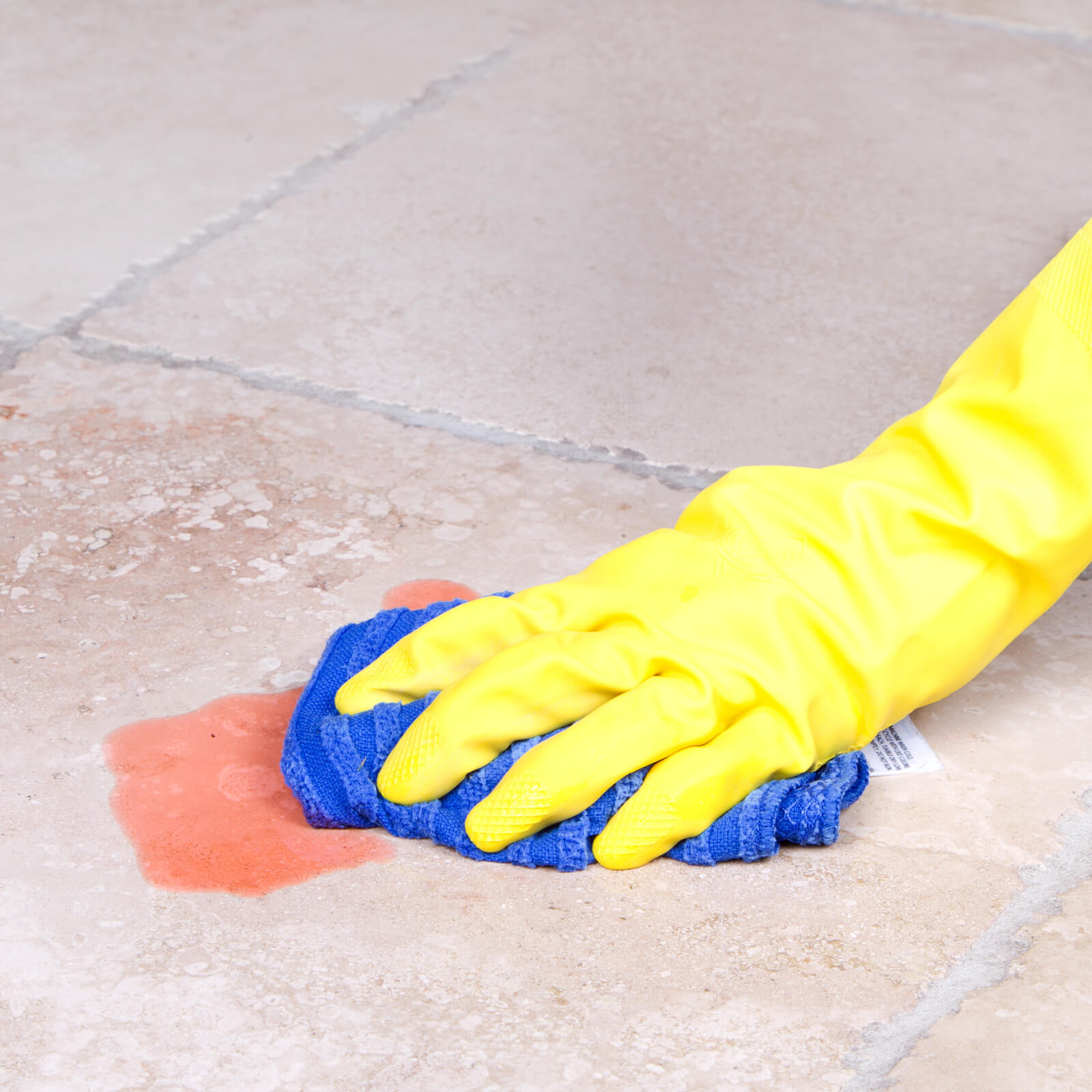 cleaning spill off of tile flooring | Flooring by Wilson's Carpet Plus