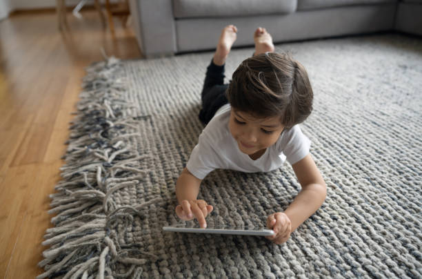 Girl lying on rug | Flooring by Wilson's Carpet Plus