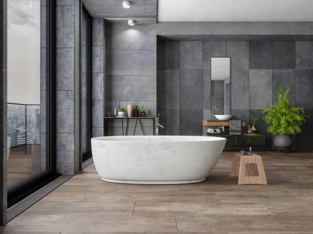 Bathroom tile dark flooring with bath tub | Flooring by Wilson's Carpet Plus