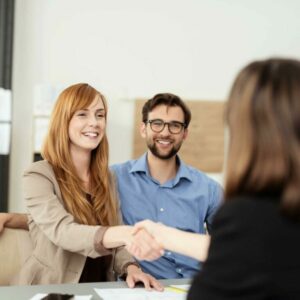 Customer shaking hands agreeing on financial terms